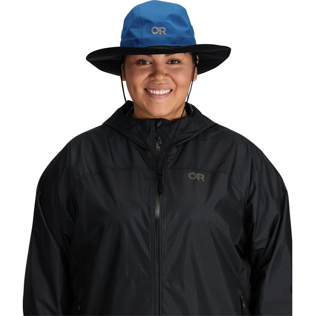 Outdoor Research Seattle Rain Hat in Blue/Black worn by a female facing forward